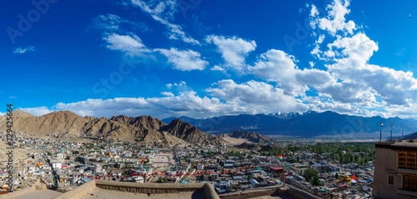Obraz Overlooking Leh town from Leh palace, panoramic view with blue sky and white clouds. The town is located in the valley of the upper Indus River at an elevation of 11,550 feet (3,520 metres).