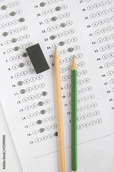 Fototapeta Standardized test form with answers bubbled in and a pencil, foc