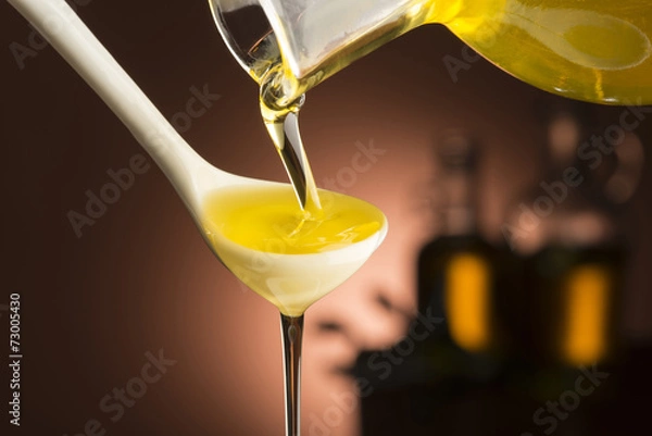 Obraz olive oil on the dark background