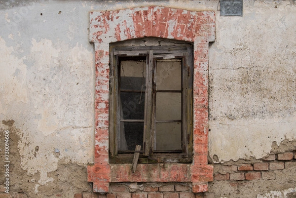 Obraz Croatia, October 20,2023 : Rustic style aged window at rural home wall.