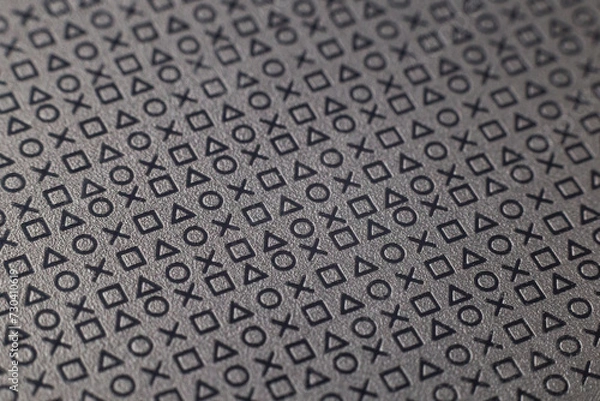 Fototapeta Pattern of symbols and signs on a flat grey surface