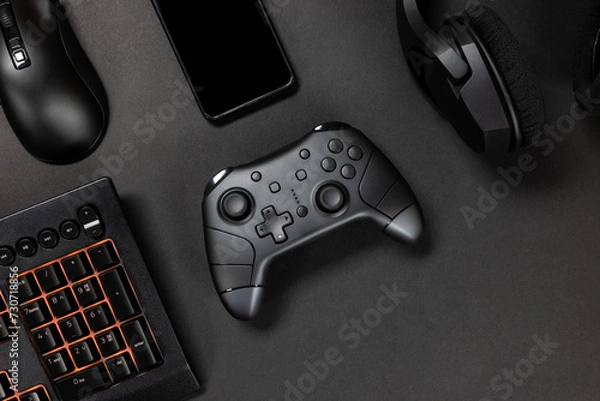 Fototapeta Game controller with gadgets and mobile phone