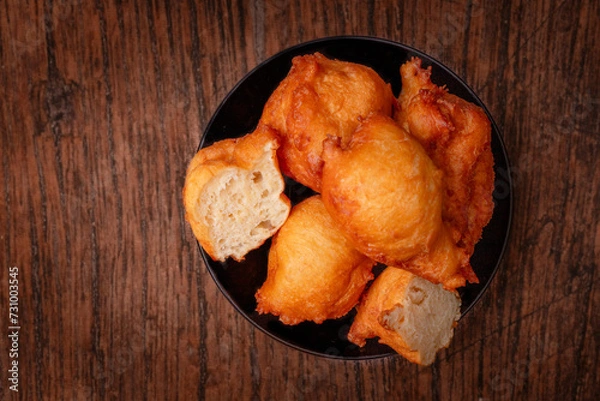 Obraz Yeast pancakes on a black plate.