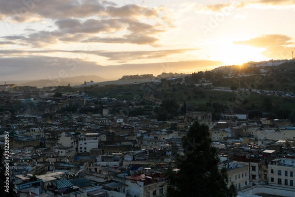 Fototapeta view of the sunrise on a rooftop of Fes