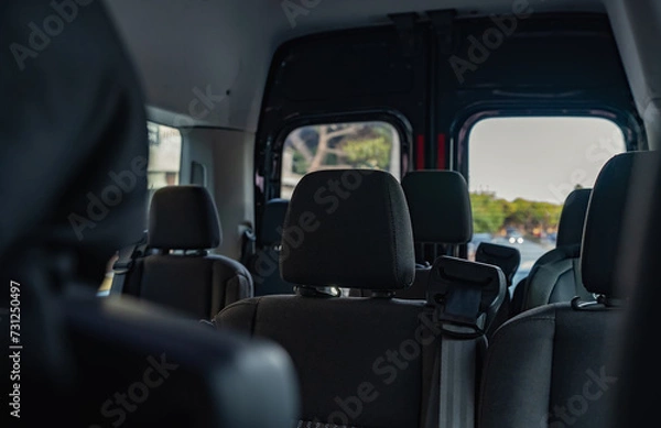 Fototapeta Interior with seats inside the minivan car.