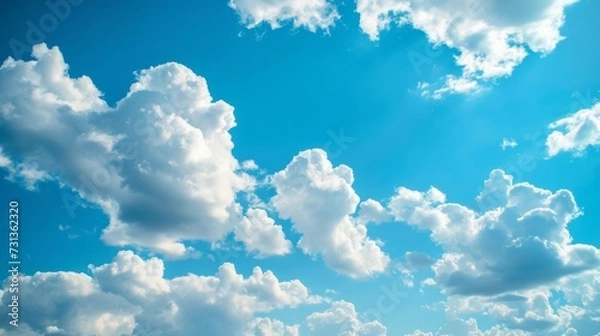 Obraz Fluffy white clouds on blue sky