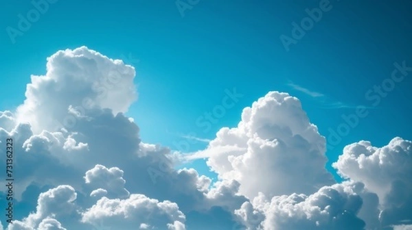 Obraz Fluffy white clouds on blue sky