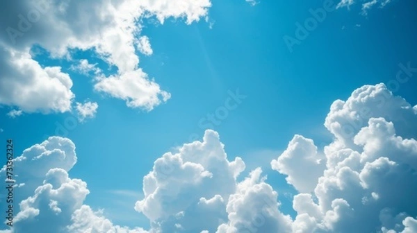 Obraz Fluffy white clouds on blue sky