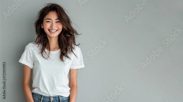 Fototapeta Asian woman wear white t-shirt smile isolated on grey background