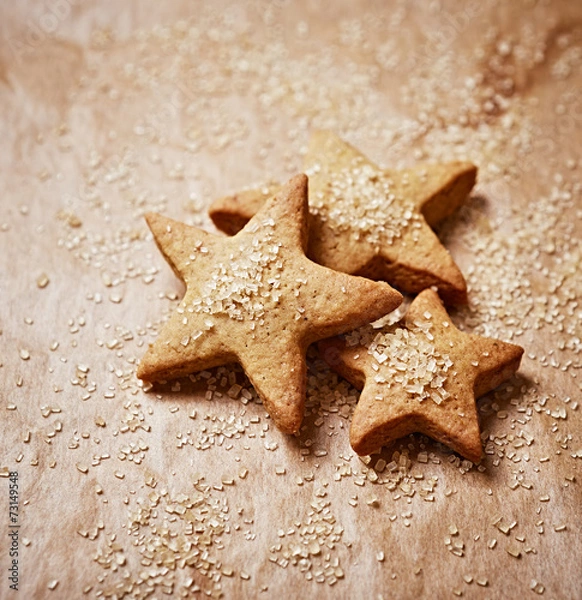 Fototapeta Gingerbread stars dusted with brown sugar