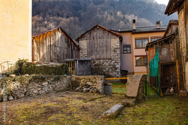 Fototapeta Old buildings in the historic hill village of Timau in Udine Province, Friuli-Venezia Giulia, North East Italy. Part of the Paluzza municipality, it is a German linguistic enclave, Val But,Carnia Alps