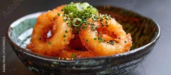 Fototapeta A delectable dish of fried shrimp, a popular seafood ingredient, served in a close-up shot on a table. This delectable comfort food is a must-try!