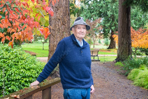 Fototapeta Active Senior Man in Autumn Arboretum and Garden