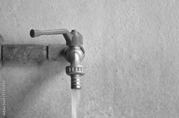 Obraz faucet on concrete  wall