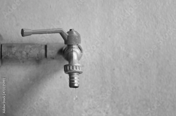 Obraz faucet on concrete  wall