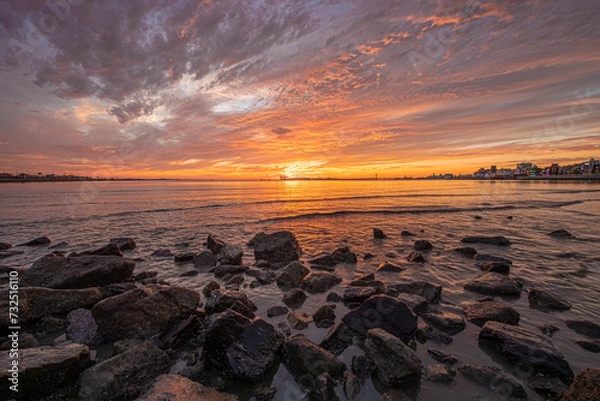 Fototapeta Beautiful sunset on the beach and beautiful clouds in the sky
