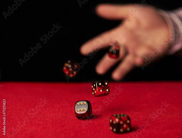 Obraz Male hand rolling dice