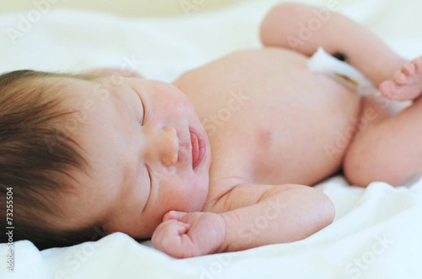 Obraz Newborn baby with umbilical cord sleeping