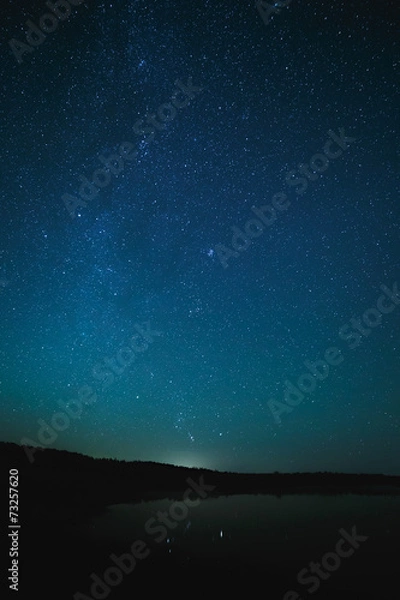Obraz Smooth surface of the lake on a background the starry sky