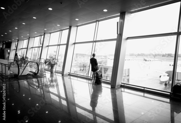 Fototapeta Monochrome  photo of woman standing in front of big window at ai