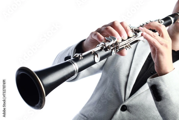 Fototapeta Clarinet player. Clarinetist hands playing woodwind instrument isolated