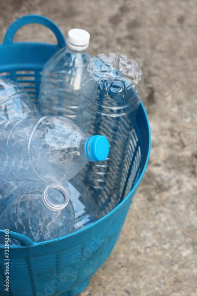 Obraz Empty drink bottles in blue plastic basket
