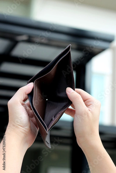 Obraz Hands holding empty brown wallet