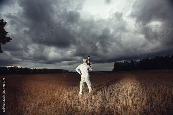 Fototapeta traveler in autumn mystical forest view from the back