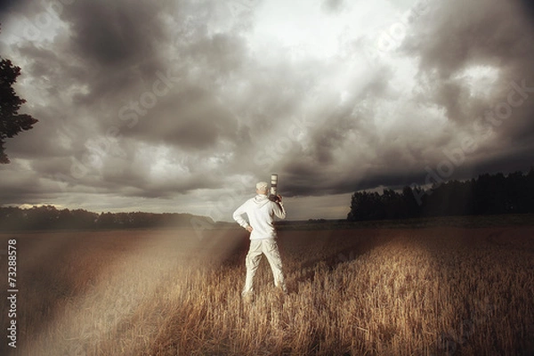 Fototapeta traveler in autumn mystical forest view from the back