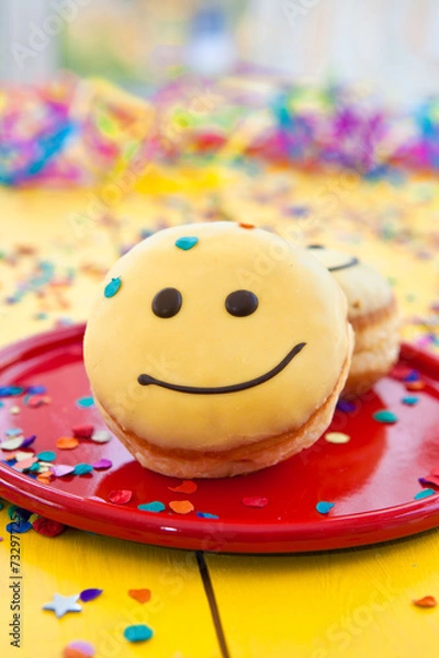 Obraz Krapfen mit Smiley Gesicht