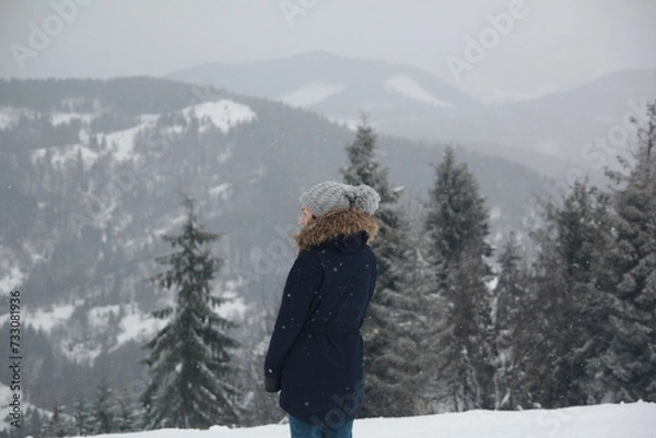Obraz person in winter forest