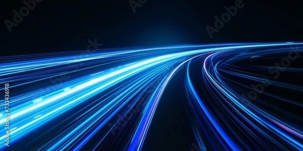 Fototapeta Blue light trails create a dynamic and futuristic abstract image representing speed and technology.