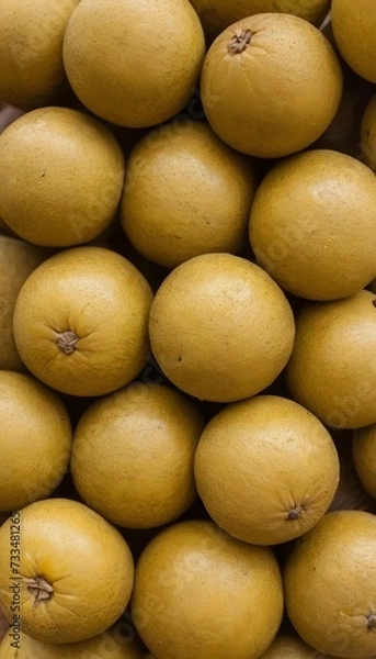 Fototapeta A close-up view of a group of ripe, vivid Marula with a deep, textured detail.