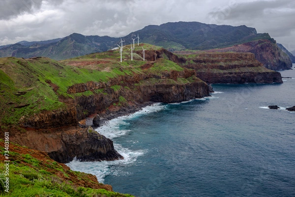 Fototapeta Rocky coast with wind farm from viewpoint - Ponta do Rosto - Madeira, Portugal