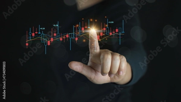 Obraz Hand of Businessman or trader is showing a growing virtual hologram stock on smartphone, planning and strategy, Stock market, Business growth, progress or success concept. invest in trading.