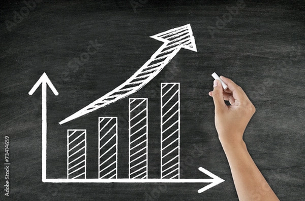 Obraz hand writing growing graph and arrow