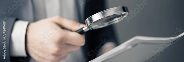 Fototapeta hand magnifier with document