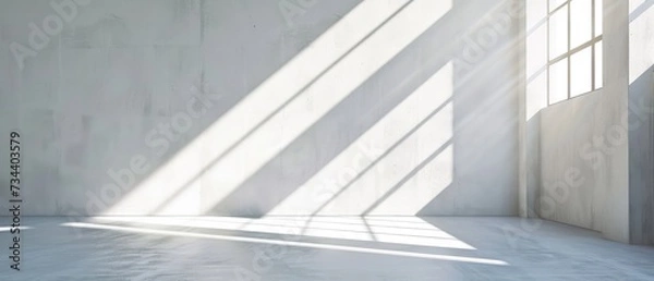 Fototapeta Spacious Industrial Loft with Sunlight Casting Shadows