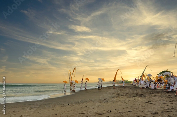 Fototapeta Melasti Traditional Ritual Ceremony in Bali Beach during Sunset as One of the Tourism Tourist Travel Attraction