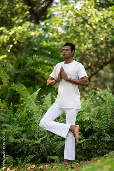 Obraz Indian man doing yoga exercise in a forest