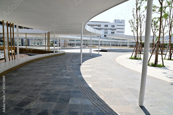 Fototapeta BANGKOK, THAILAND - February 14, 2024: New Parking Building D with a beautiful connecting road go to Government Complex (A Building), Thailand.