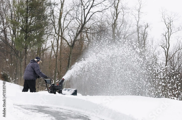 Obraz Man Using Snow Blower to Clear Snow