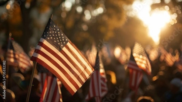 Fototapeta Background blur of crowd at political rally in the United States holding signs and carrying US flags. Great image for upcoming election cycle in 2024 presidential campaigns. Copy space