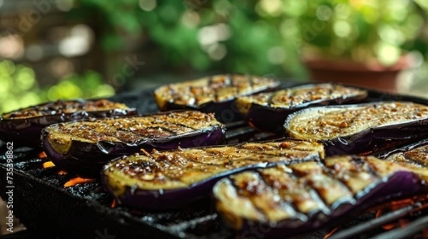 Fototapeta photo of grilled eggplant, summer yard on background --ar 16:9 --v 6 Job ID: 937f9062-5ff8-4252-b38d-9bd6028e2b97