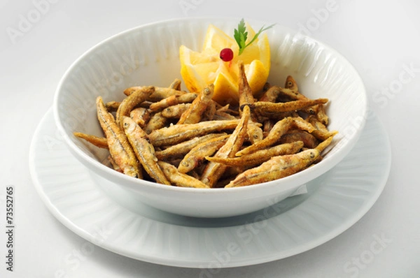 Obraz Smelt, capelin, small mackerel in corn batter with lemon