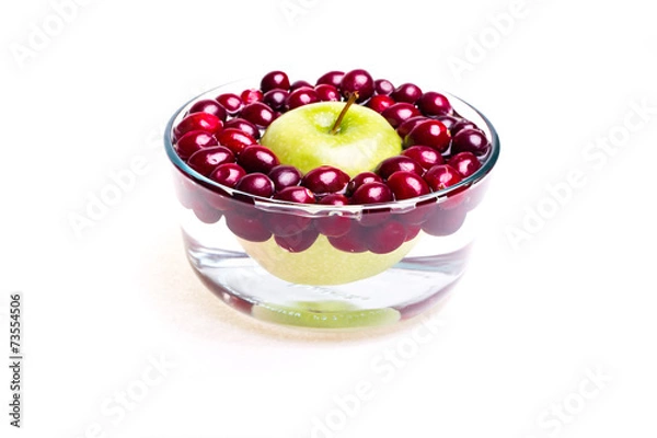 Fototapeta Cranberries and apple, small bowl, side view.