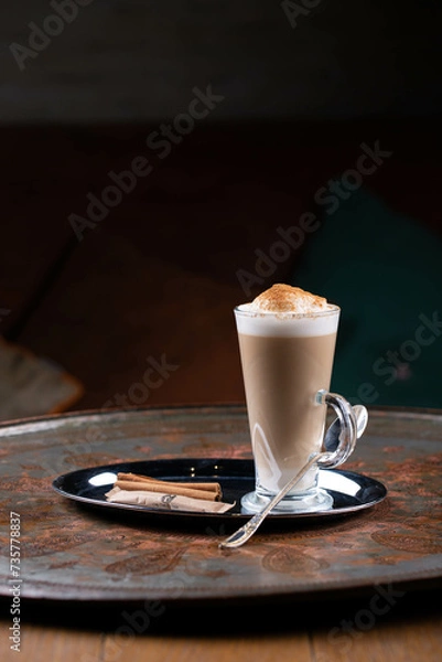 Fototapeta Cup of coffee latte on the table, dark background, restaurant menu