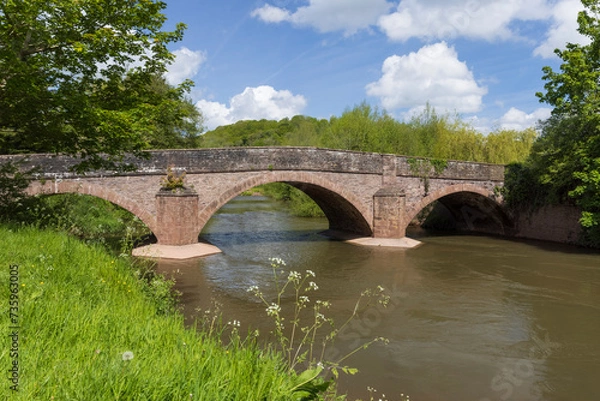 Fototapeta The road bridge over the River Monnow at Skenfrith built in 1824. Monmouthshire, Wales, UK