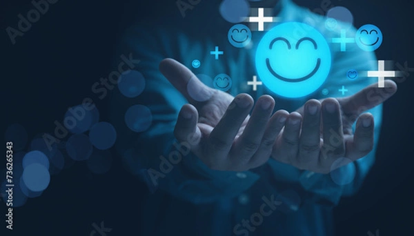Fototapeta Mental health positive thinking and growth mindset. Hands holding blue happy smile face icon good feedback rating, positive customer review, experience, satisfaction survey, smiley mental health.