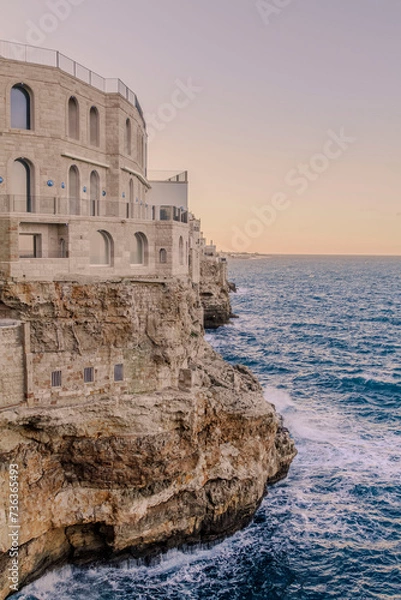 Fototapeta view of the walls of the city of Polignano a Mare, located on a slope on the Adriatic Sea widok na mury miasta Polignano a Mare, położonego na zboczu nad Morzem Adriatyckim